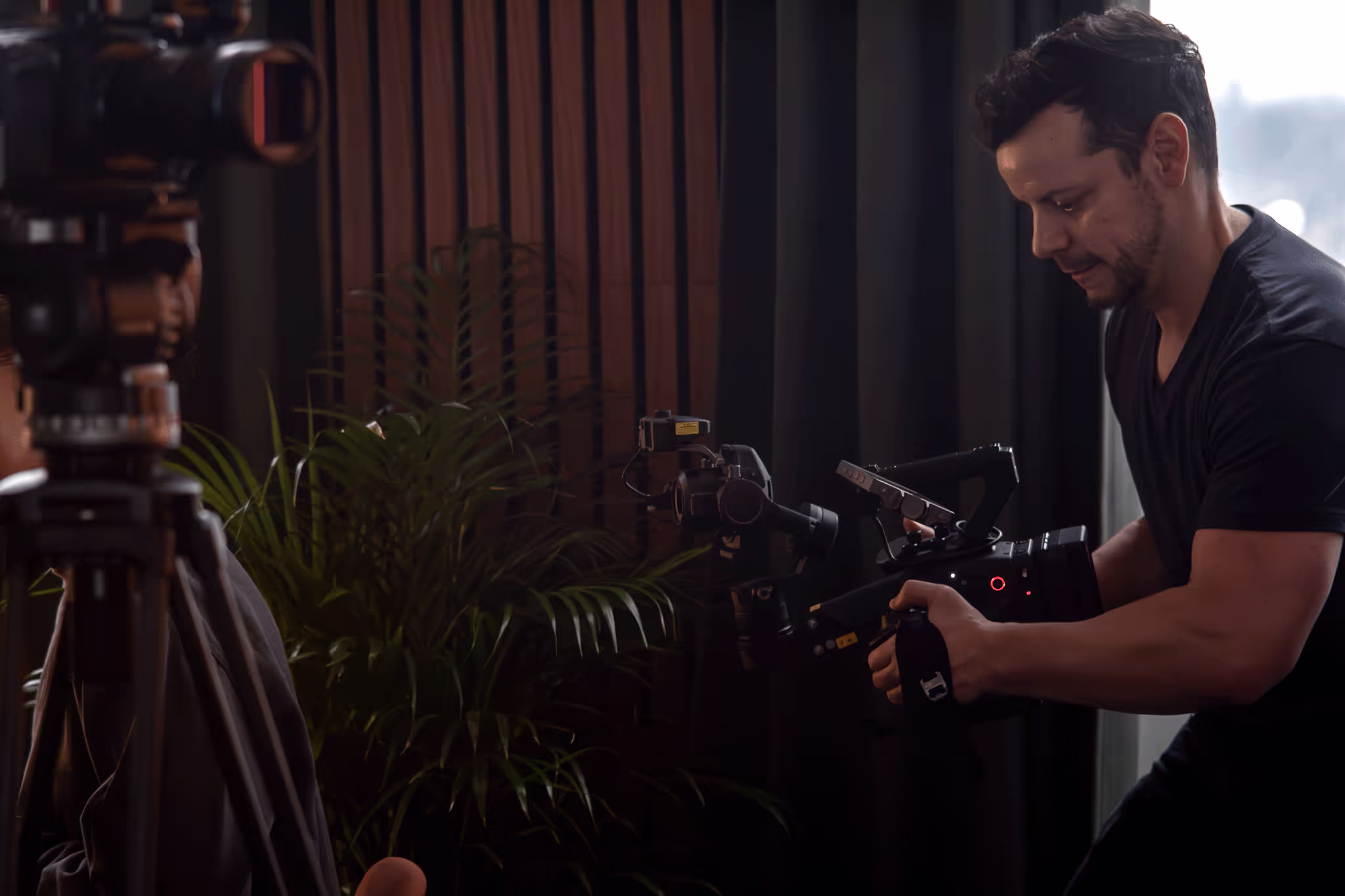 Person filming in a hired studio.